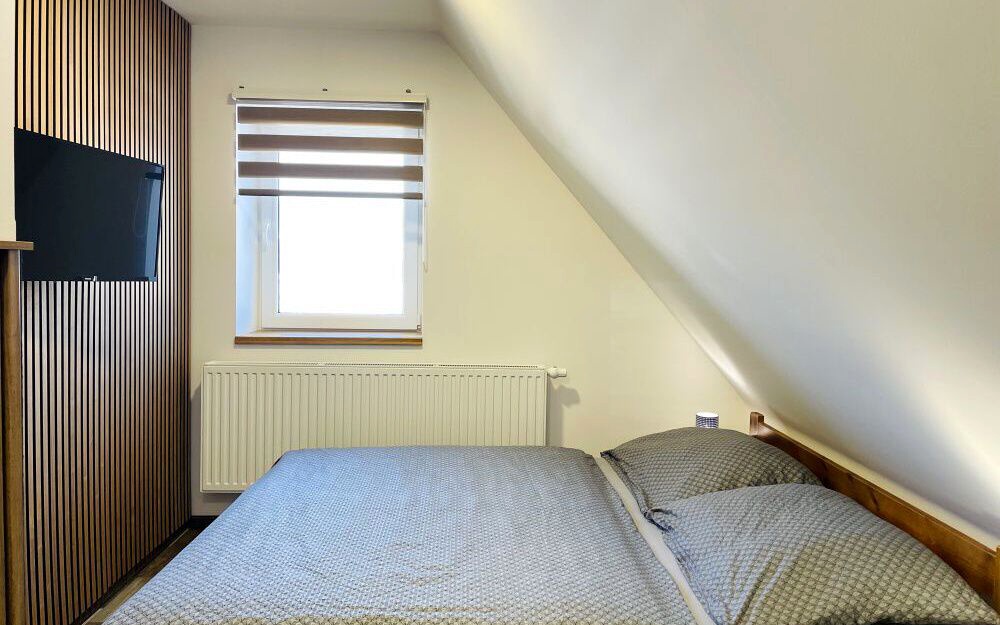 Podkrovní třílůžkové pokoje